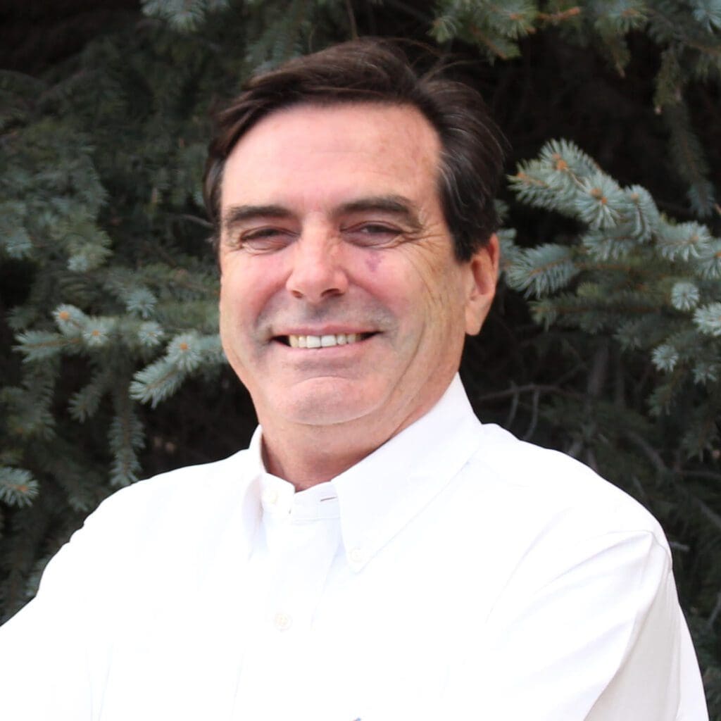 A man wearing a white shirt at Fann Contracting.